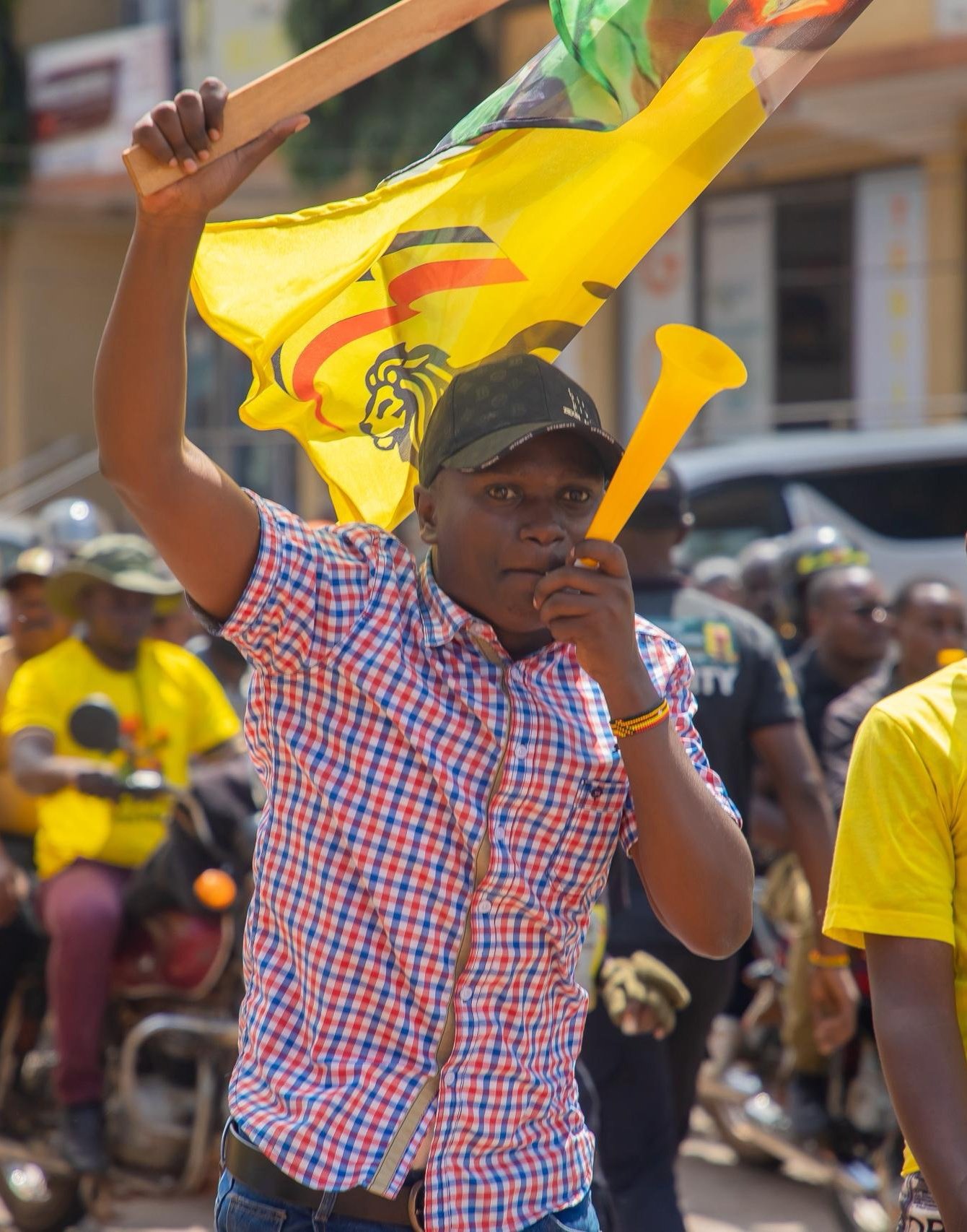 Young PLU supporter raising the movement flag